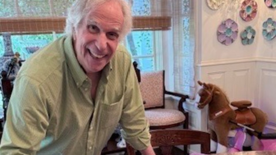 Actor Henry Winkler signing my portrait of him.