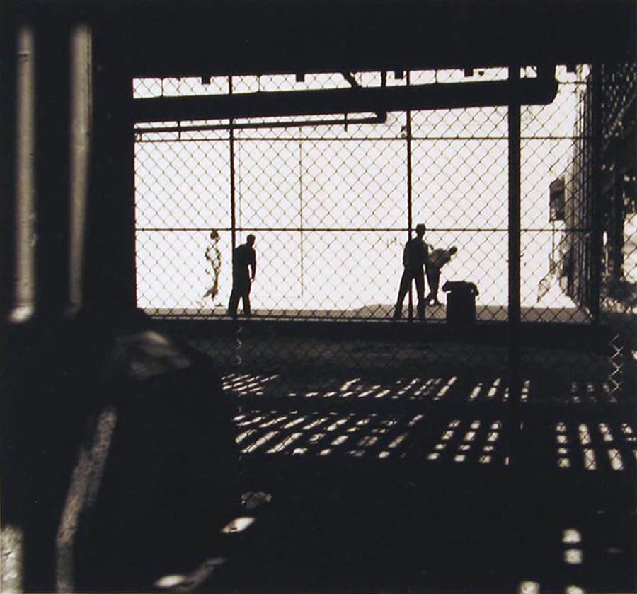 Fenced in Kids Playing by N. Jay Jaffee 