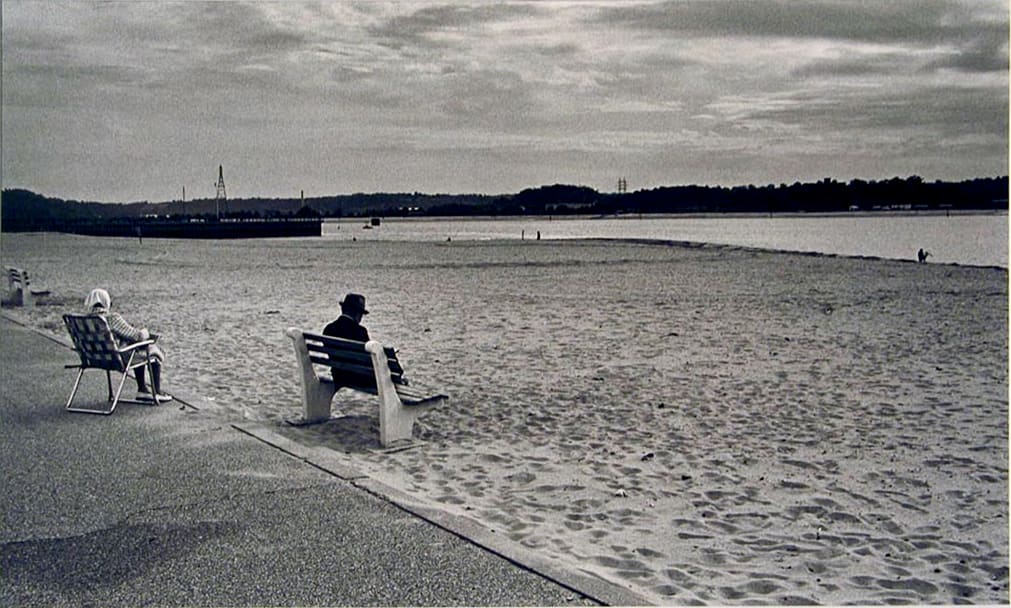 Man on Bench at Beach by N. Jay Jaffee 