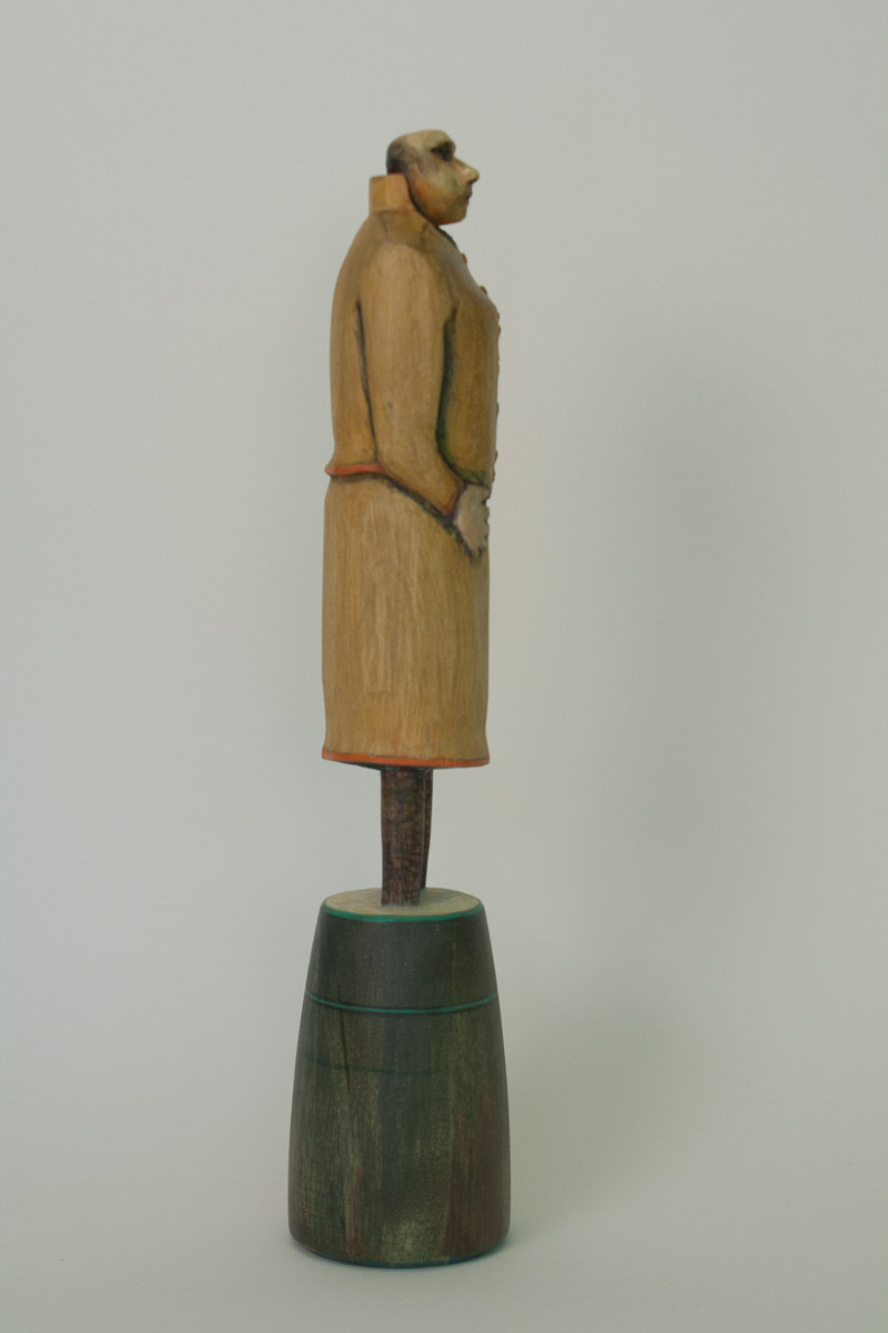 Woman in Ochre Suit (side view) by Eve Whitaker 