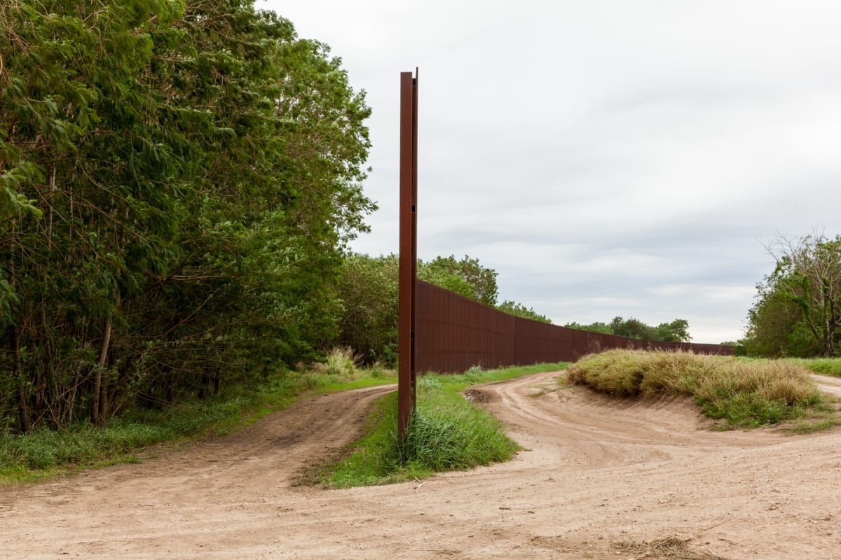 Border Wall near Brownsville (Muro fronterizo cerca de Brownsville), from the portfolio Borders a... by Susan Harbage Page 