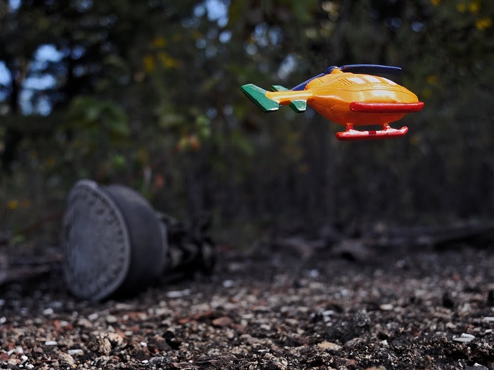 Approximate Altitude 12.0 Inches, Inches Above Earth Series (Yellow Helicopter over Boot) by Michael Reese 