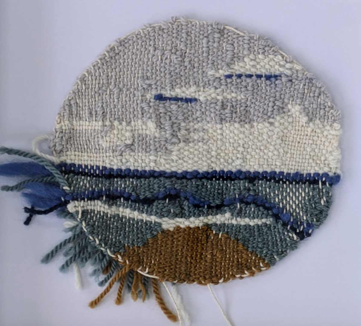 Sea breeze by Roxas Arzt Studio by Anna Arzt  Image: This piece was done off loom, in the shaped tapestry technique. Being close to nature and being near the ocean is one of our favorite things to do as a family. I always weave when I'm at Fripp Island and wanted to capture those moments in this work.