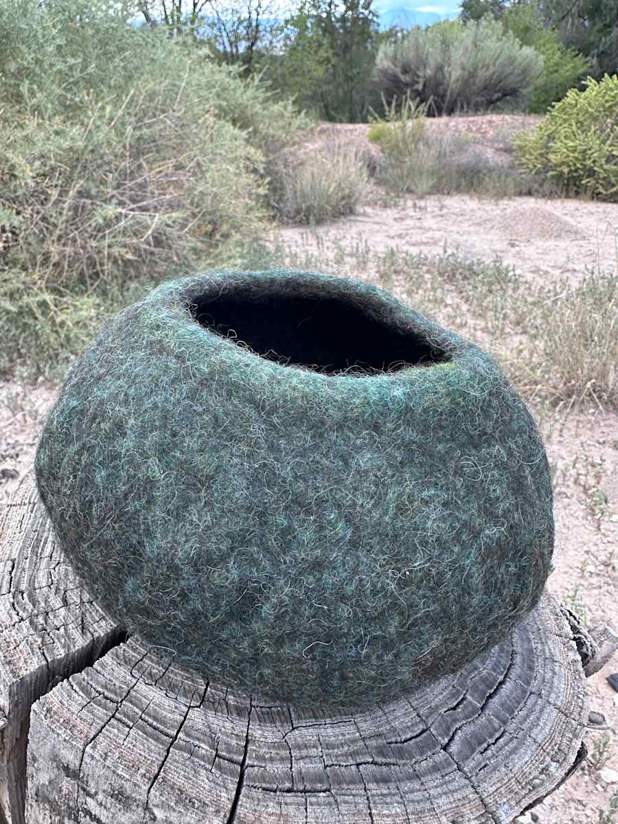 new life by Andrea Dupree  Image: Made by hand from recycled wools using a wet-felting process. This piece offers a lightweight soft, sturdy sanctuary that can be displayed on a surface or wall (I like to use t-pins).