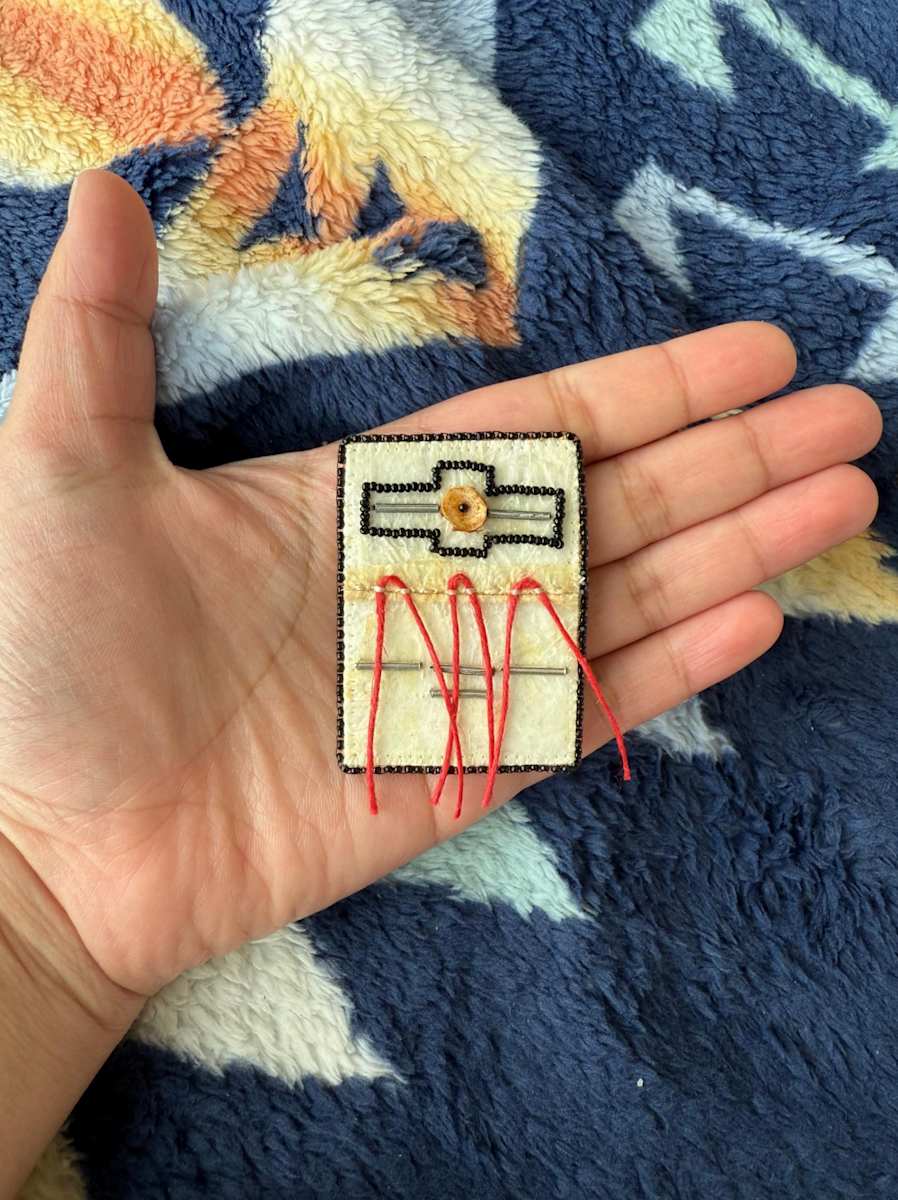 Seal Gut Pendant by Tava Kairaiuak 