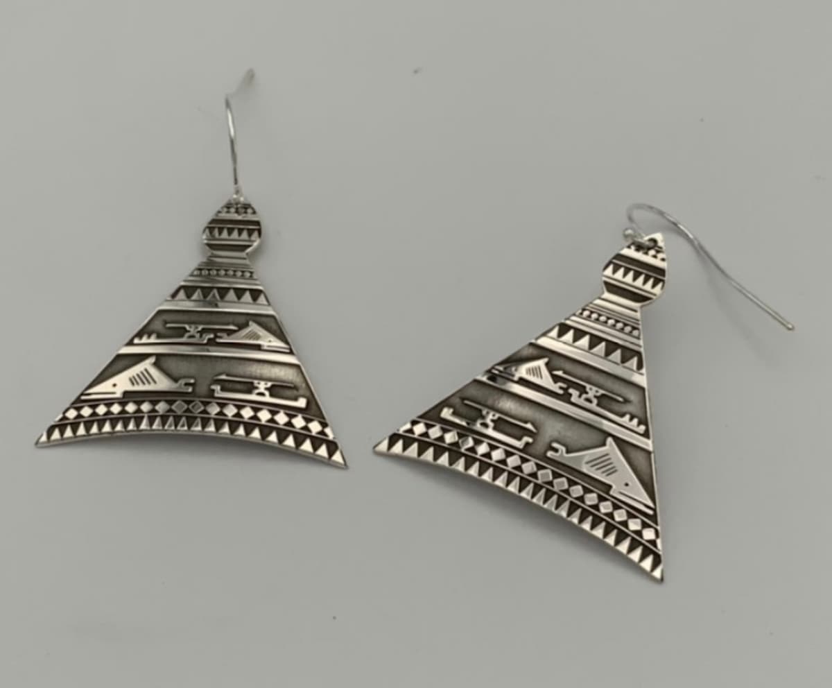 Silver hats earring by Gerren P 