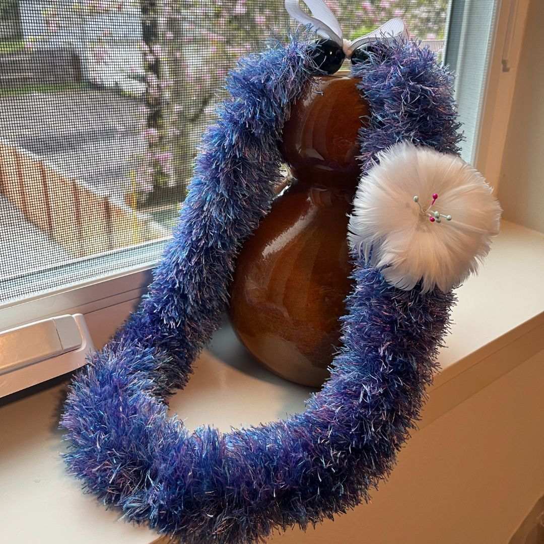 Lei me ka pua hulu (Lei with feather flower) by Kēhaulani Metke-Arakaki 