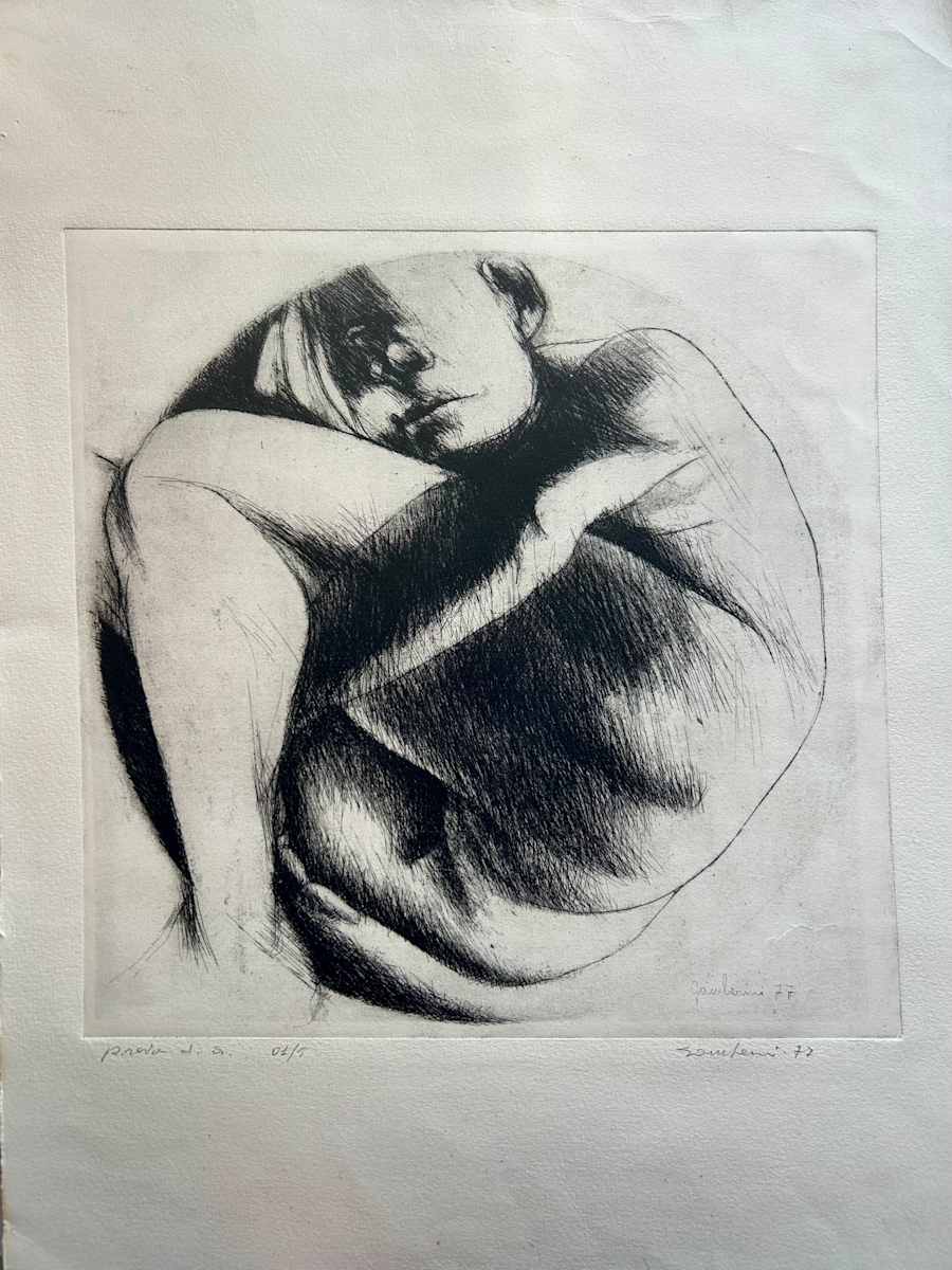 Untitled by Ruggero Gamberini  Image: A tightly framed human figure is rendered in expressive, sweeping marks that lend weight and emotional charge to the pose. The subject’s face, half-shadowed and introspective, emerges from the surrounding mass of limbs. The posture - tense yet quiet - evokes a private psychological state, possibly one of containment, withdrawal, or inner resistance. Gamberini’s technical command of line and tone accentuates the sculptural density of the body and its existential stillness. Edition of 5.