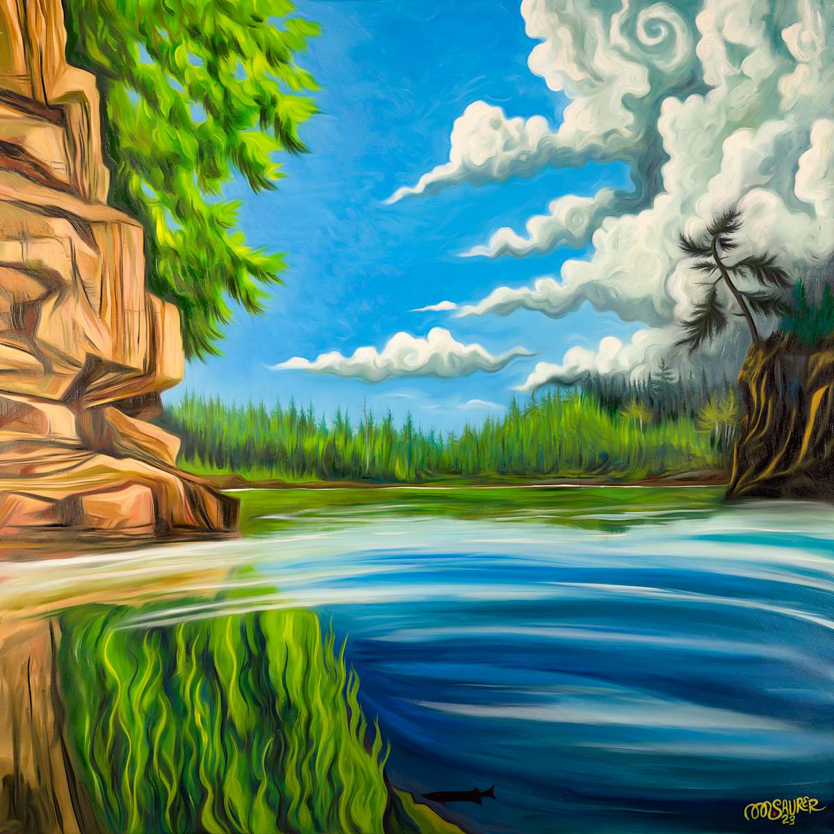 Lake Orby by Marissa Kayne Saurer  Image: Lake Orby features a rocky cliff on the left with lush green foliage extending from it. The foreground showcases a tranquil body of water reflecting the cliff and the vivid blue sky above. Billowing, whimsical clouds form intricate patterns, enhancing the sky's dynamic feel. In the background, a dense line of trees spans the horizon under the bright sky, adding depth to the scene. The colors are rich and saturated, creating a visually striking composition.