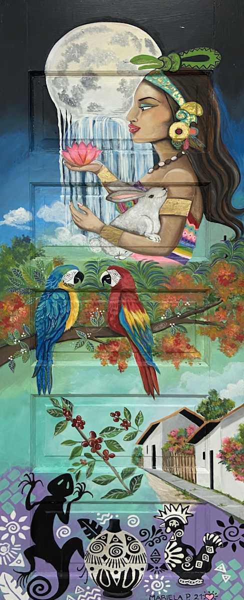 Honduras - Doors to Mi Barrio by Mariela Paz  Image: "I made the door of Honduras. I had the idea of 
showing the beauty of what is Mayan, with Lenca and 
with coffee, which is very much part of the Honduran  culture. So, I painted Ixchel, who is the Mayan goddess of the moon. She has a rabbit; she is always carrying a 
rabbit. And, at the bottom I made a sample of alfarería or pottery  Lenca, which is an ethnic group in Honduras. And there are also some  things, some sprigs of coffee, some typical houses. That enchanted me.  I enjoyed it so much that now any door I see, I'm going to want to paint  doors."