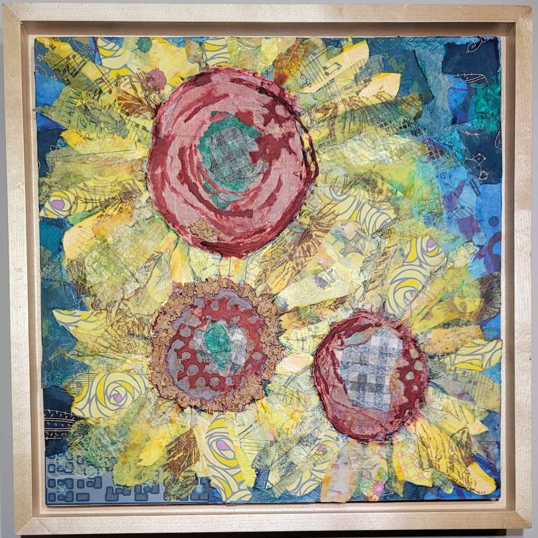 Sunflowers by Jan Somers  Image: My creative process begins with using various inks and salt paints on various types of papers to create a rich color pallet. Created first on paper, elements are added using scrape papers and found objects such as circuit boards, maps, and dictionary pages to create the initial design. The piece is sewn with different threads to add texture. 
Once mounted on art board additional elements are then added creating a finished piece with hidden objects all adding to the fun and the finished piece. 
