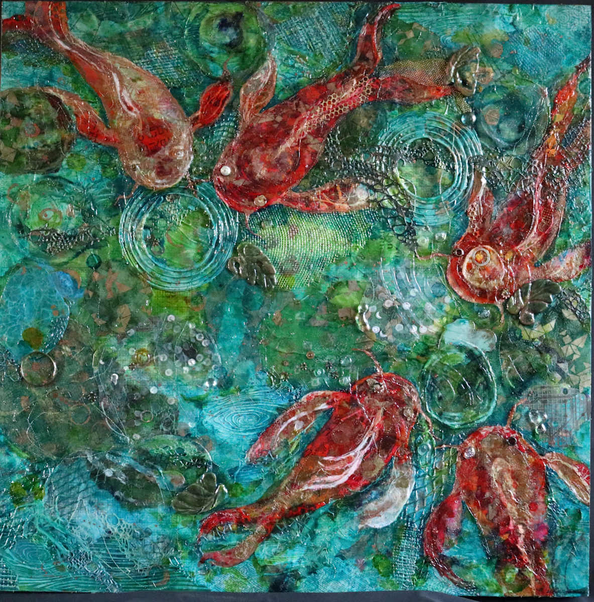 Koi Pond by Jan Somers  Image: My creative process begins with using various inks and salt paints on various types of papers to create a rich color pallet. Created first on paper, elements are added using scrape papers and found objects such as circuit boards, maps, and dictionary pages to create the initial design. The piece is sewn with different threads to add texture. 
Once mounted on art board additional elements are then added creating a finished piece with hidden objects all adding to the fun and the finished piece. 
