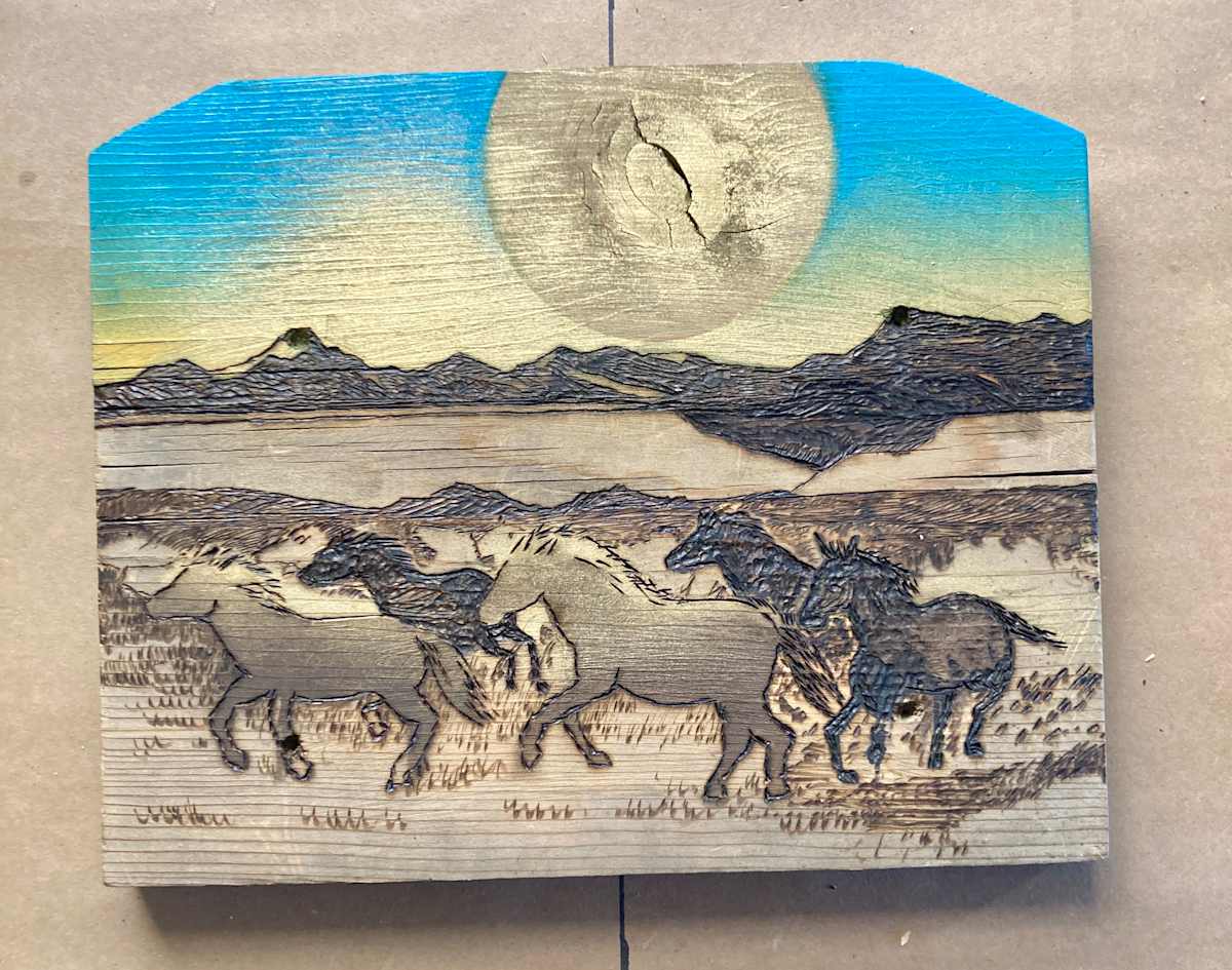 Horse Moon by Heart of the Sun Gallery  Image: Spray paint wood burning 2025 Josephine Thomason and Joseph Marshall  on repurposed wood