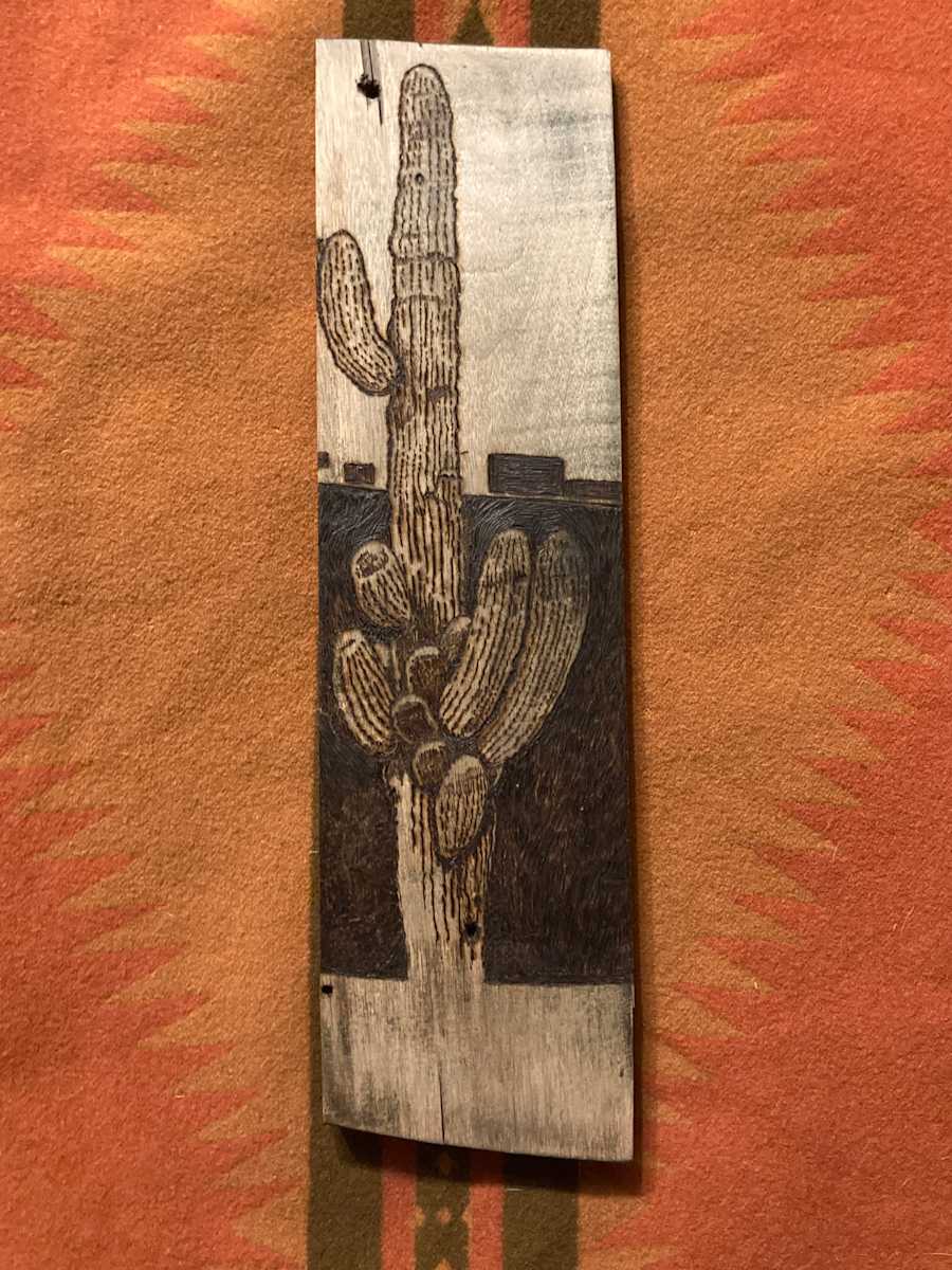 River Ril by Heart of the Sun Gallery  Image: Pyrography on repurposed furniture 2023 Joseph Marshall 