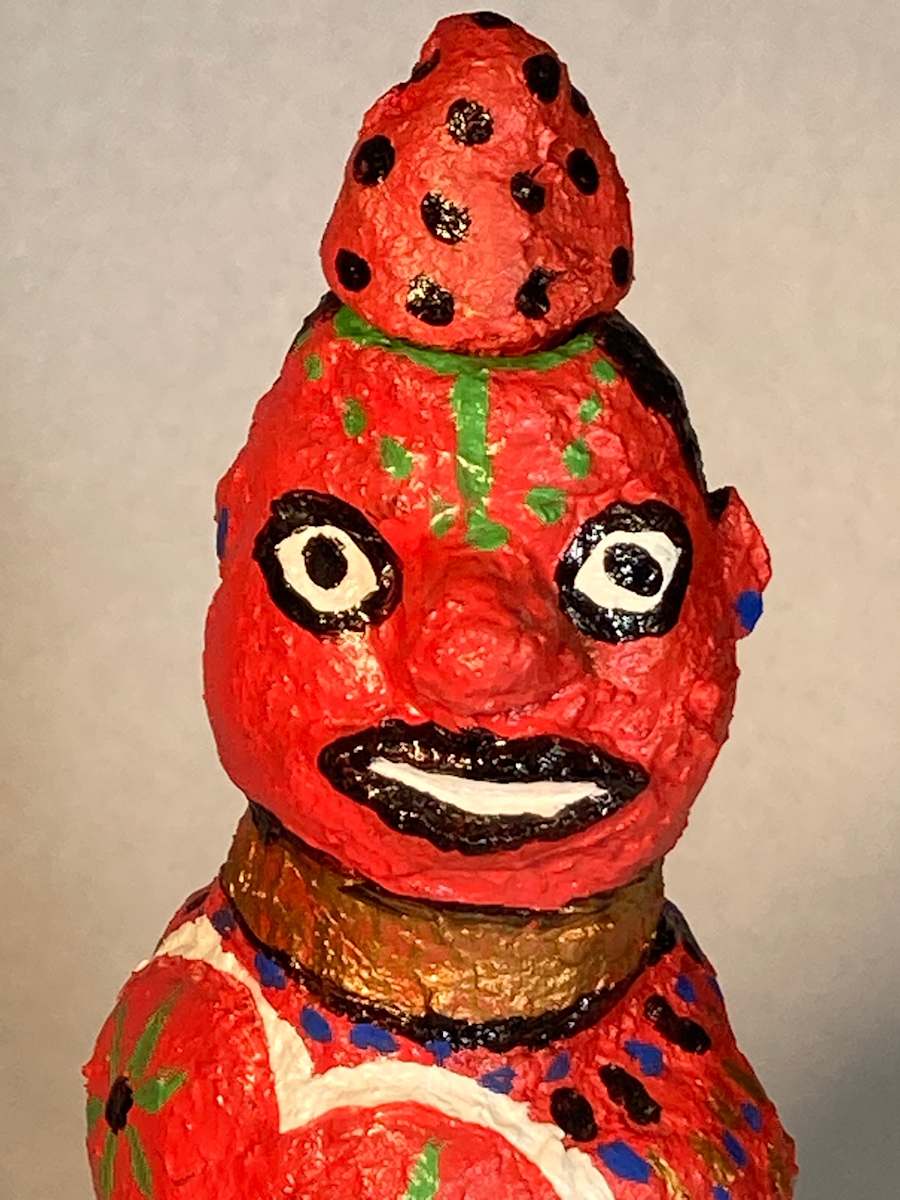 Red face with green dots anad red hat with black dots by Jennifer Taylor 