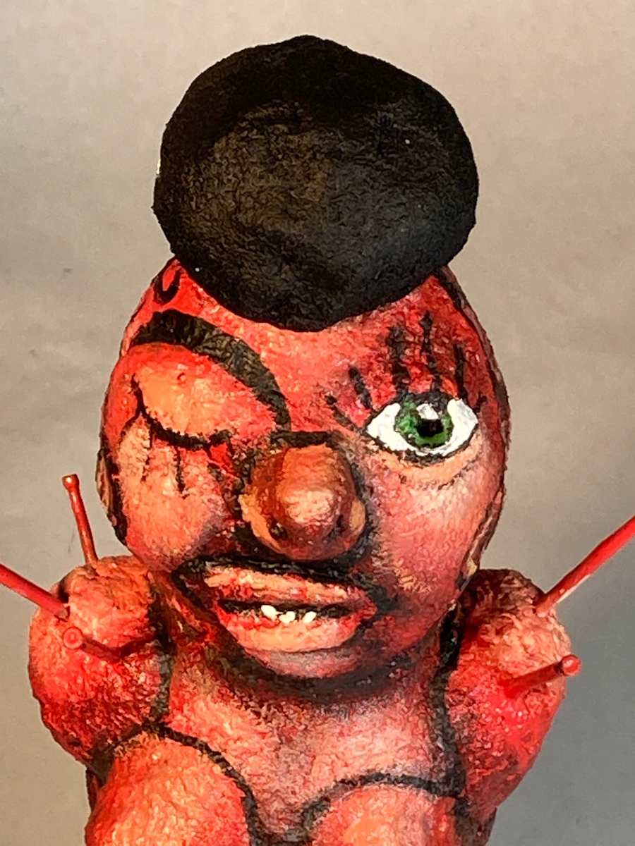 Red face one eye open and black hat by Jennifer Taylor, Image 1.