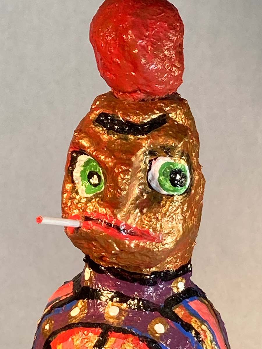 Gold face red hat smoking by Jennifer Taylor 