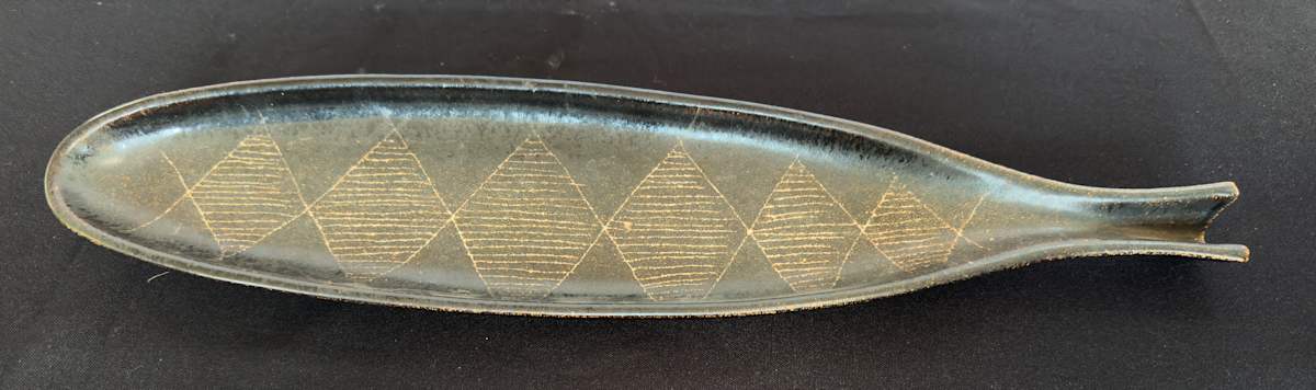 Brown serving tray by . Mann 