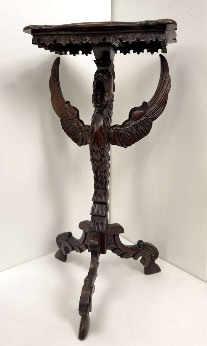 Small table with winged creature 