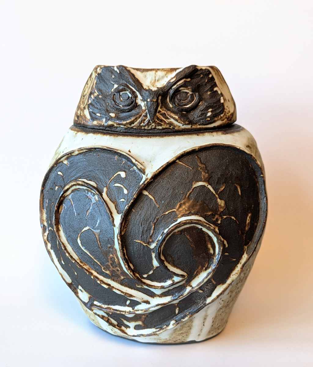 Waves Owl Vase by Jill Robinson  Image: Lidded vase made with black mountain stoneware clay, fired to cone 10 in reduction. Glazed with glossy white.