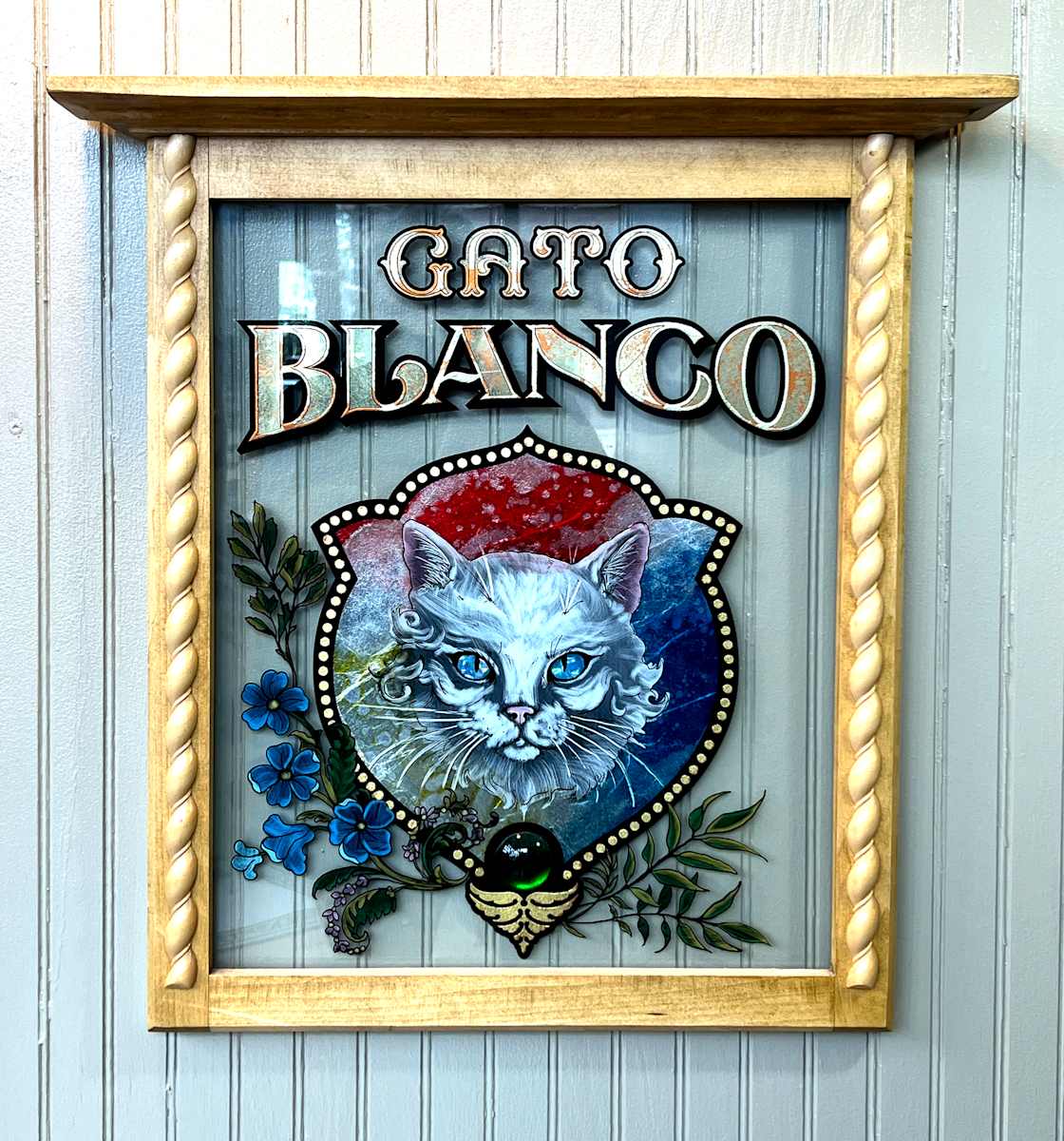 Gato Blanco by Sean Michael Felix  Image: Painted and gilded glass, wood frame