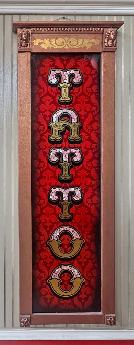 Tattoo by Sean Michael Felix  Image: Reverse painted glass, bespoke frame.