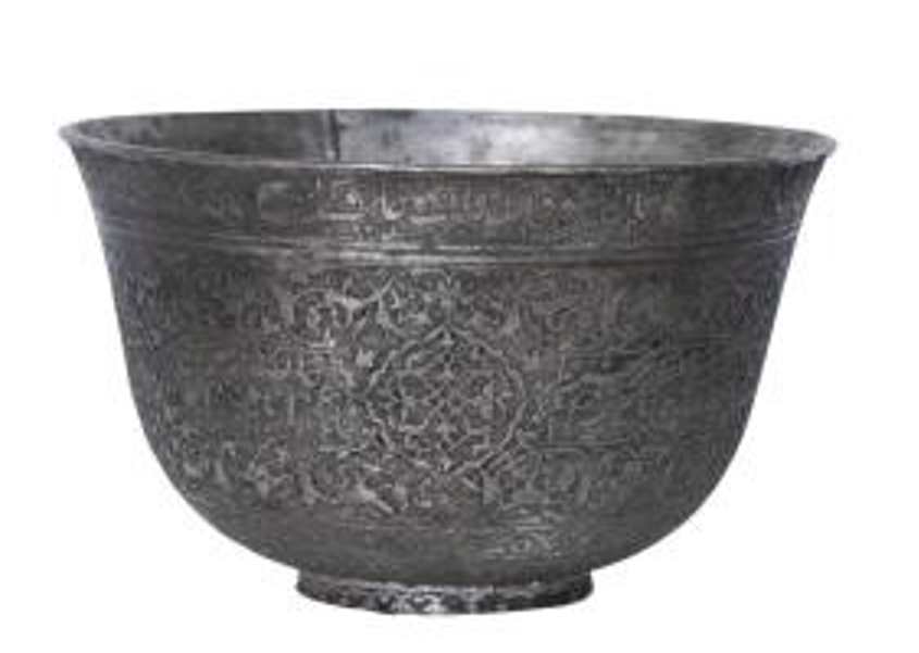 Tinned Copper Bowl  Image: Safavid tinned copper bowl from western Iran with flared rim and dense engraved decoration. Features scrolling vegetal motifs, central medallion, and inscribed poetic band lending lyrical elegance.