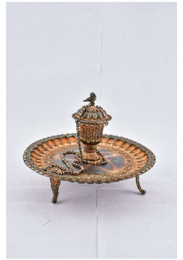 Perfume Container (Attar dan)  Image: This stunning perfume container blooms like a lotus when opened, its domed, bird-crowned lid revealing perfumed treasures. Framed by petal-like motifs and delicate scrollwork, it embodies the mechanical grace and sensory luxury of courtly India.