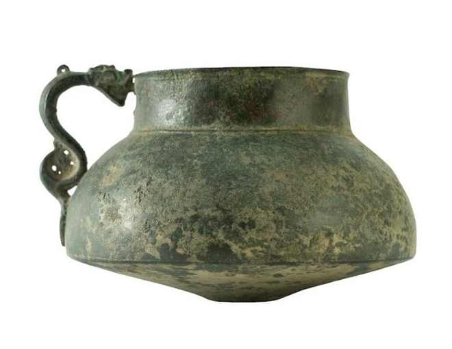 Bronze Jug  Image: Rare Timurid bronze jug with a broad flared body, sharp foot-ring, and sculptural dragon-shaped handle. A striking fusion of form, function, and mythic imagination from Central Asia.