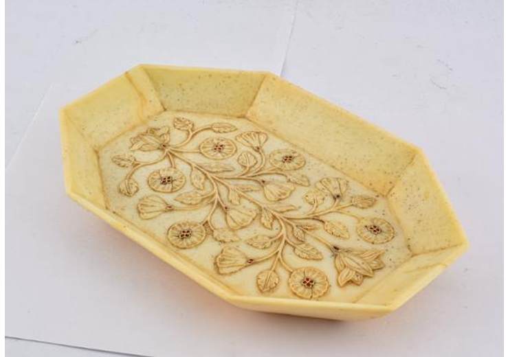 Tray  Image: Octagonal jade tray carved with delicate botanical motifs; inset rubies accent the blossoms, enhancing its elegance and regal allure.