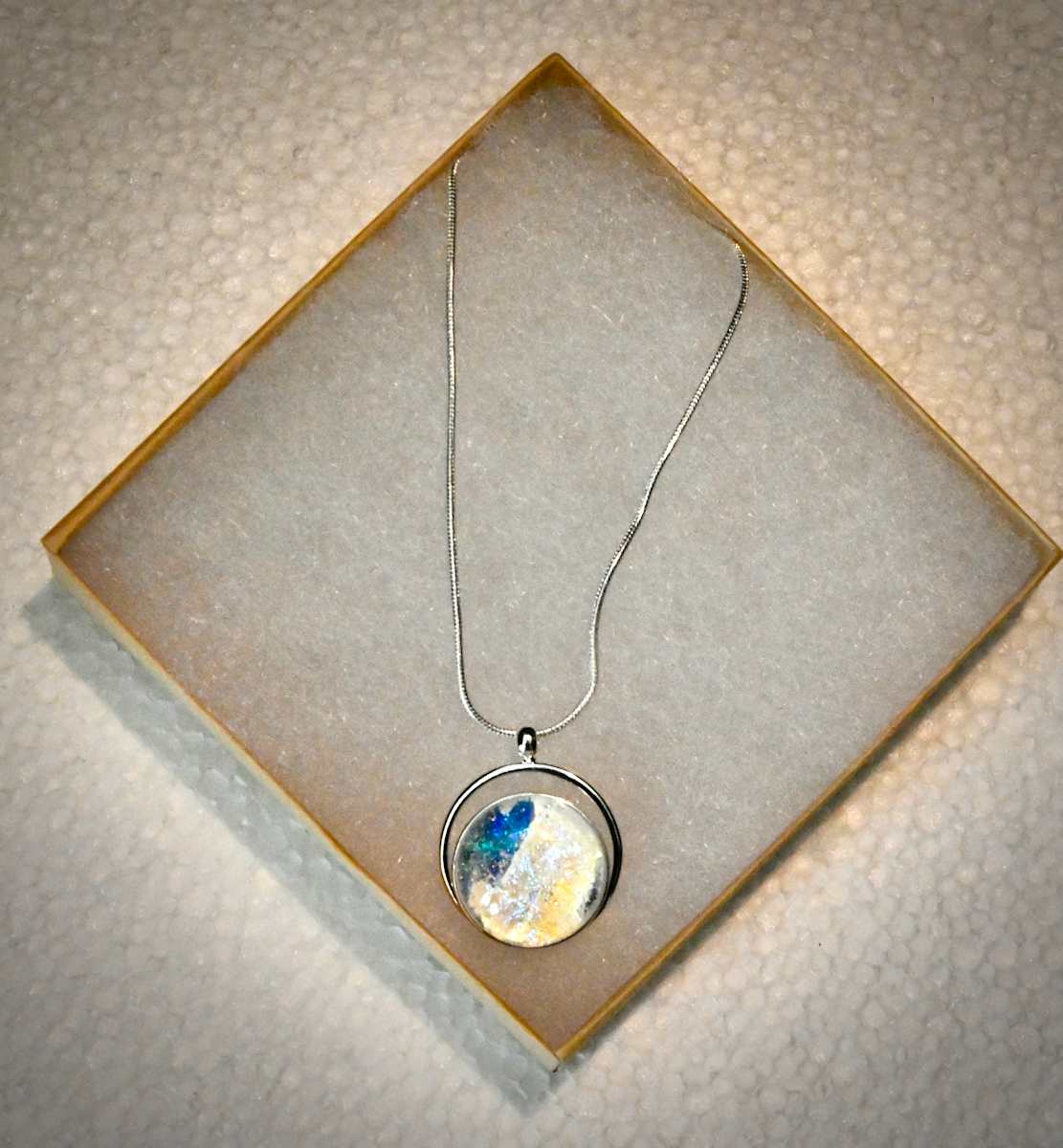 Single Opalescent arc setting necklace by Susan Mason 