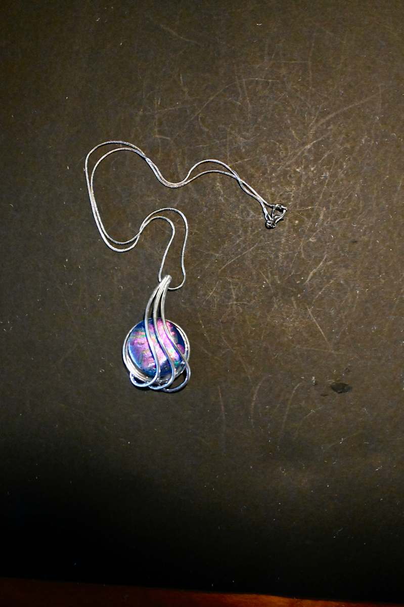 Fused dichroic glass sterling silver pendant by Susan Mason  Image: front