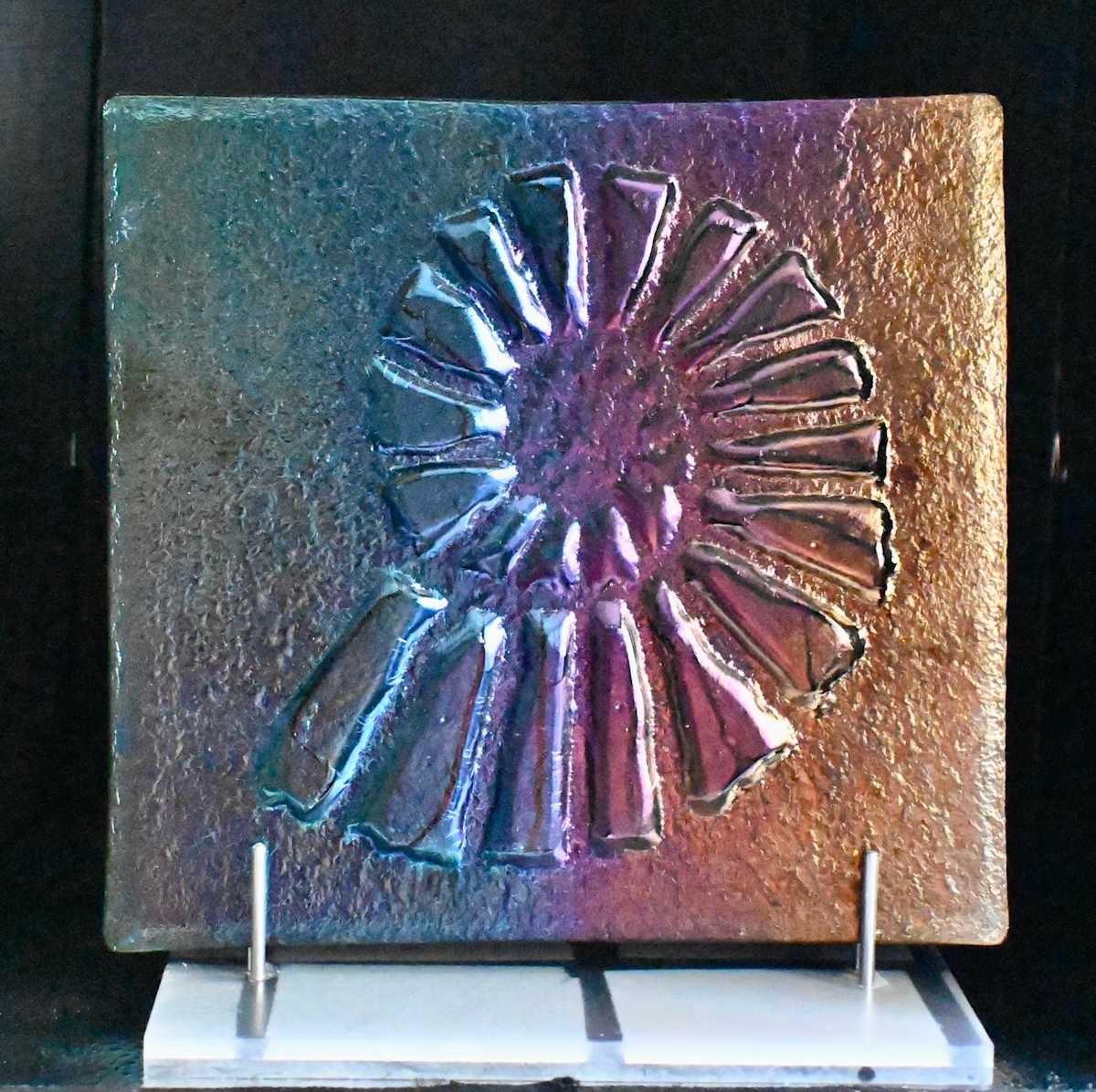 Nautical by Susan Mason  Image: Ammonite--kiln carved iridized fused glass on stand