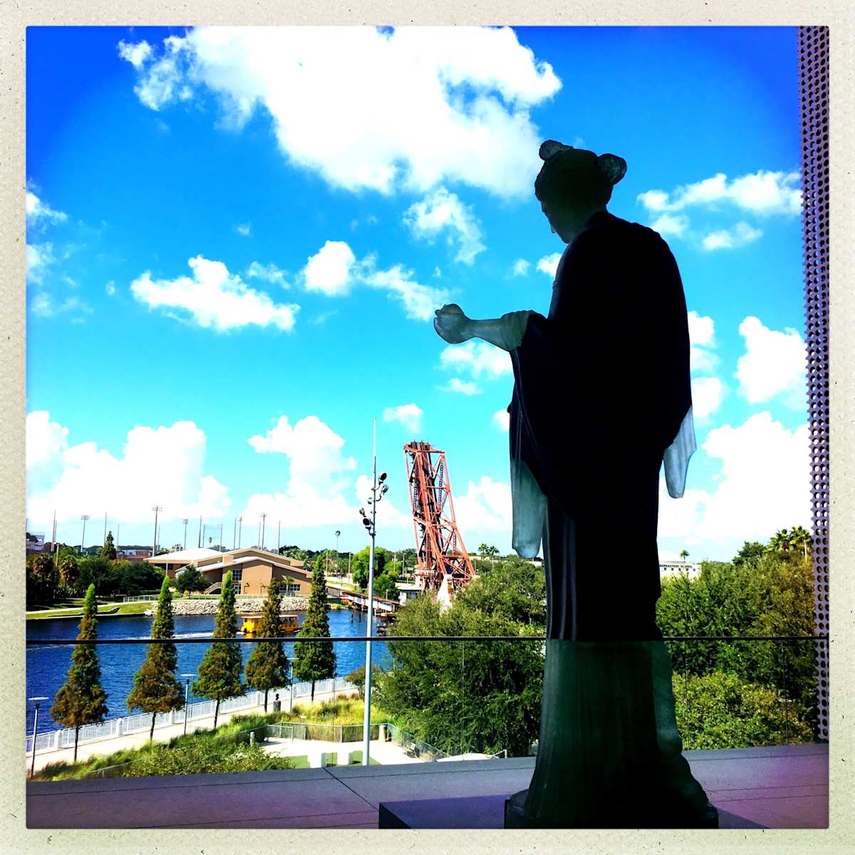 From the Mount by Sherry Ross  Image: Classical mythology tells of gods watching over mortals from their lofty perch on Mount Olympus. This silhouette evokes Athena, goddess of wisdom—not gazing over a pastoral Grecian countryside, but instead seeking guidance in an orb as she surveys a modern landscape. The image left me wondering: is there still room for the Old Gods in the new world order?