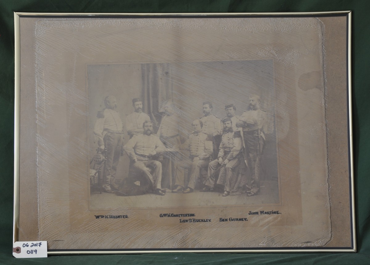 Photograph of Nine Uniformed Men 