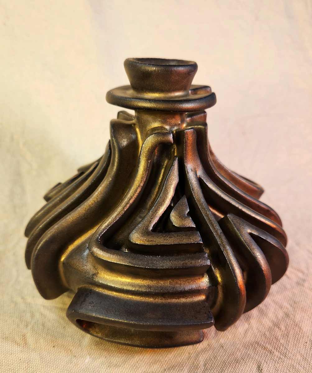 Bronze Assemblage Vase III by Tony Hyden  Image: small modernist sculptural vase glazed in a bronze color with a raised mazelike design