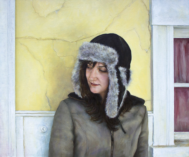 Sophie at the Island Theater by Elizabeth R. Whelan  Image: An artist poses in front of a dilapidated theater in Oak Bluffs.