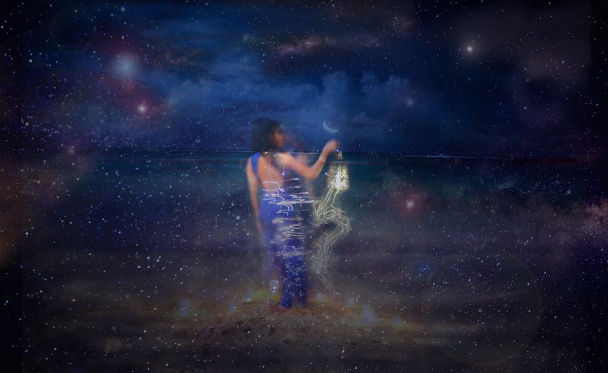 Luminaria by Tashina Marie  Image: She stands beneath a sky thick with stars, lantern in hand, as if coaxing light from the silence. Around her, the cosmos gathers like a veil, and before her, a bowed spirit takes form—cloaked, maternal, and luminous with stillness. There is no fear in their meeting, only recognition. This is a place between worlds.
“Luminaria” invokes the ancestral gesture of light-bearing—the ancient and sacred act of guiding souls through darkness. Its name echoes the small candle-lit lanterns placed on thresholds, rooftops, and graves to welcome the divine and honor the dead. In this image, that tradition is transformed into a cosmic rite. The lantern becomes a beacon for spirit, memory, and presence.
The veiled figure may be a night goddess—Nyx veiled in stars, Nut arching over the horizon of the seen and unseen, Selene descending with the moon. She may be the Virgin or the Black Madonna, protectress of the lost and guardian of the in-between. She may be an ancestor, come to guide the living forward or lead the departed home.
This is the realm of the Hermit’s lantern, of Persephone’s return, of the soul walking the edge of form and formlessness. Light here is not simply illumination—it is remembrance, sanctuary, and initiation.
Luminaria is a prayer in the dark. A witness. A guide.
 It is the quiet miracle of being seen by what was never gone.