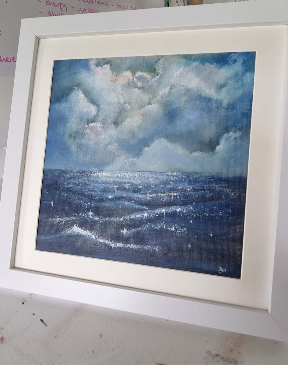 Stormy sky & sunlit water by Debi Garrett, Image 1.