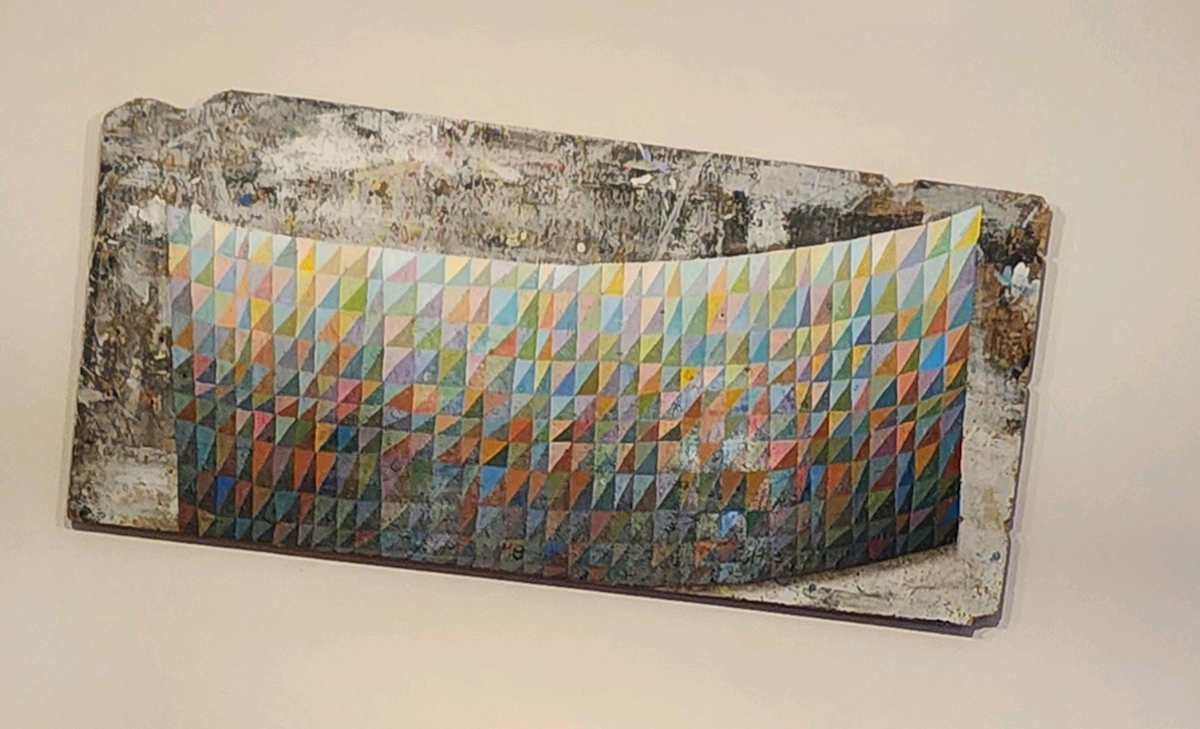 Try Angles by Micah Bloom  Image: Micah Bloom's "Try Angles" is mounted on a special hanger that intentionally angles the painting as intended by the artist.