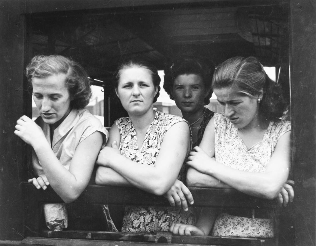 Four Girls in a Train Window by Edward R. Miller  Image: Four white women leaning on the sill of a train window