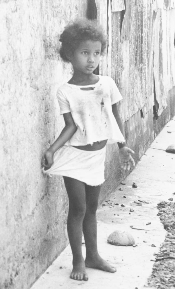 Panama Main - 51 by Edward R. Miller  Image: Young black child in tattered white clothing