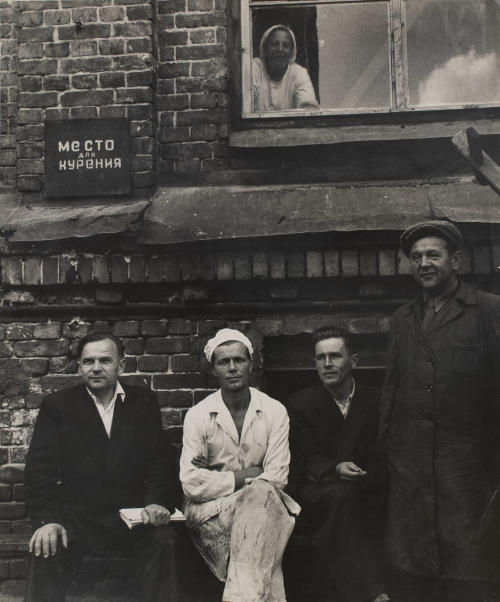 Moscow Russia 1956 Factory Workers by Edward R. Miller  Image: Four white people sitting at ground level and one white person looking down from a window above their head.