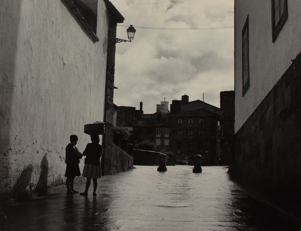 Spain 1962 Near Vigo by Edward R. Miller  Image: Two people on stone street, one with a basket on their head