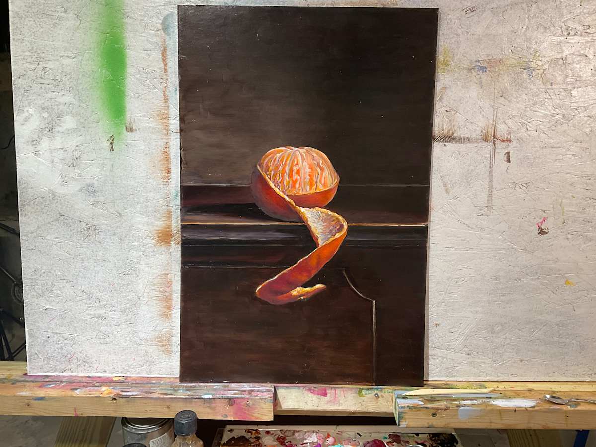 Orange on piano by Rebecca e 