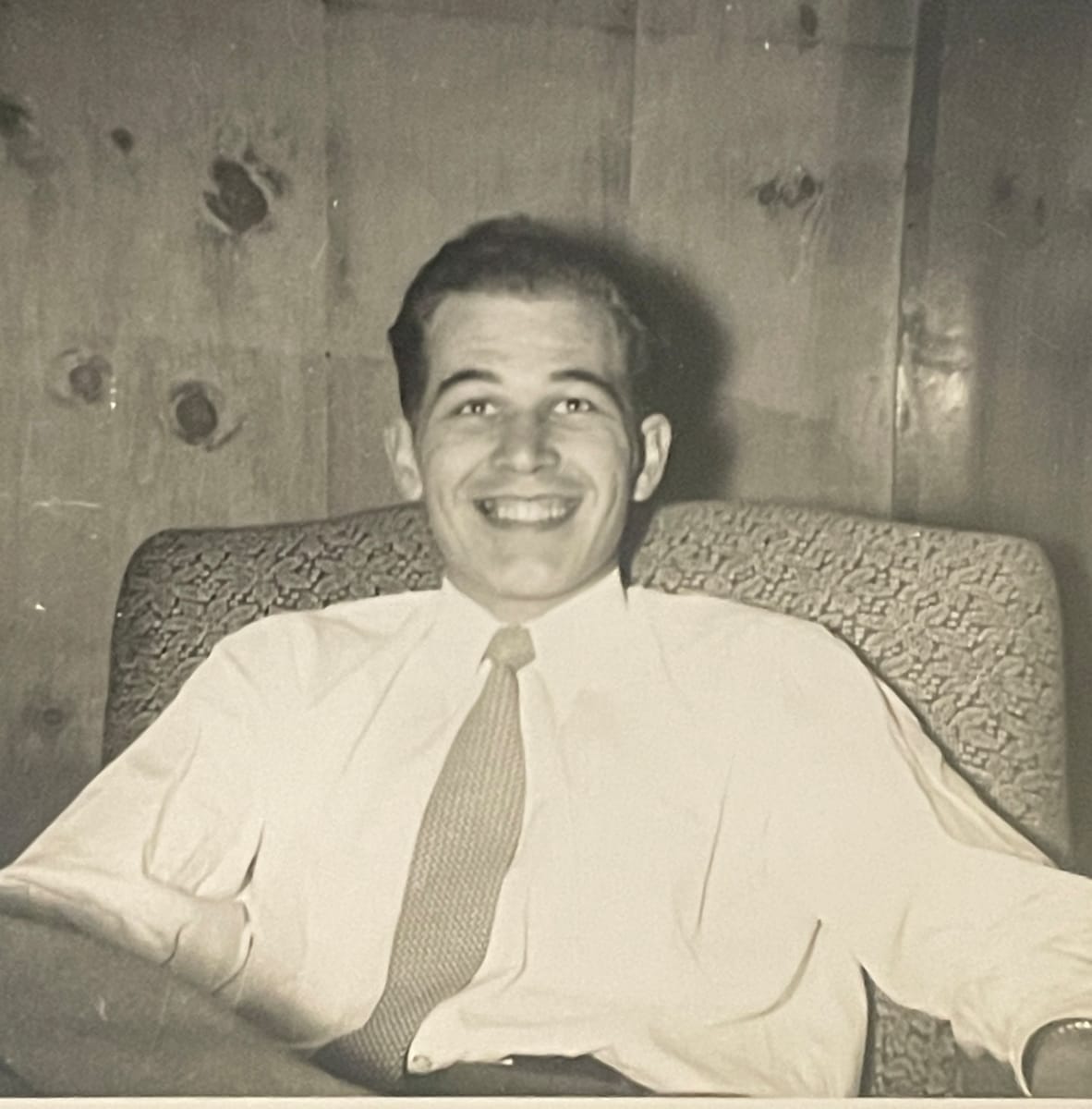 Handsome man smiling in chair 