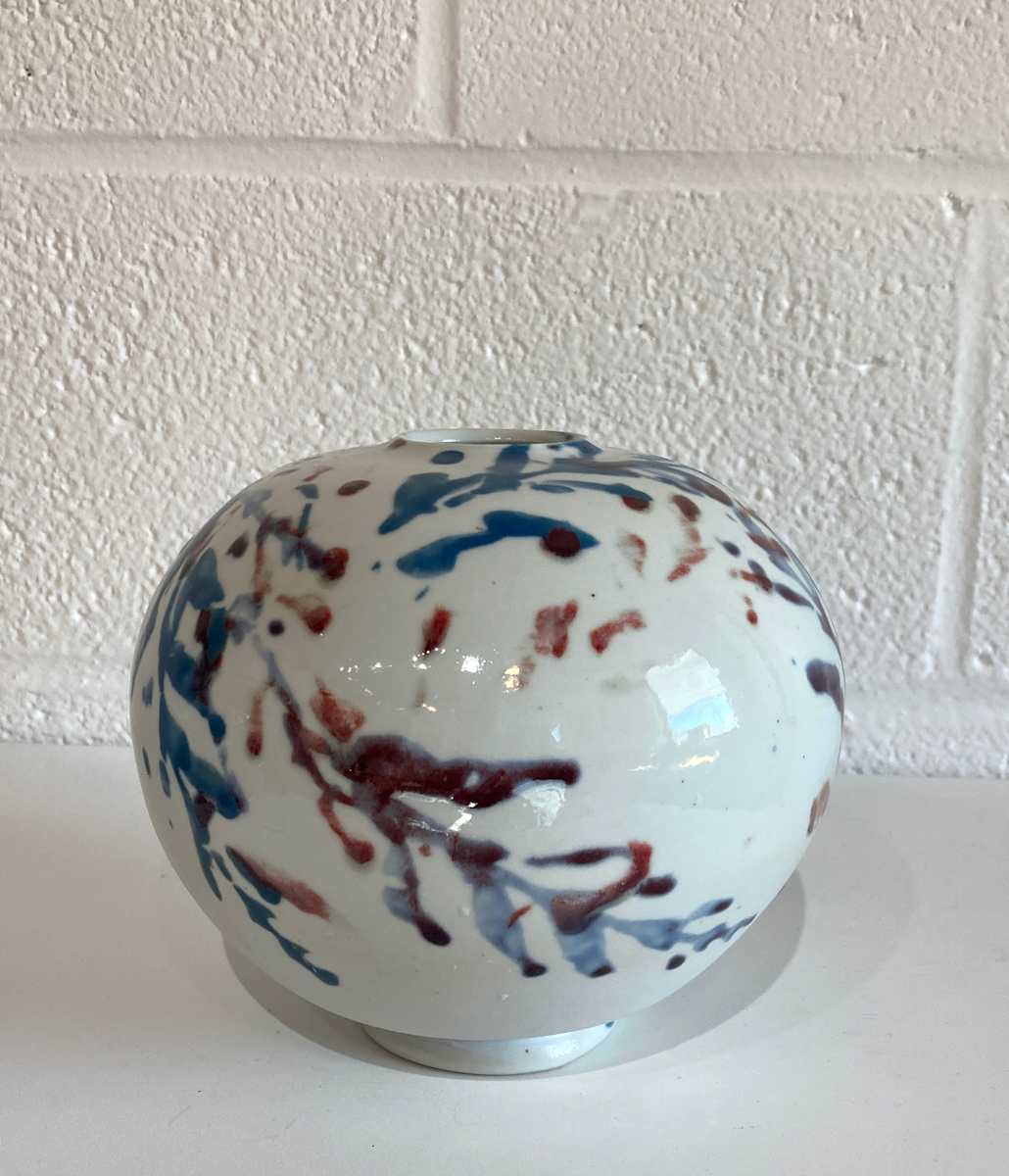 Porcelain -  medium round vessel with multicolor leaves by Cali Almy , Image 1.