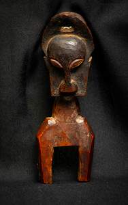 Untitled (African Carved Janus faced Heddle Pulley) by Artist Unknown 