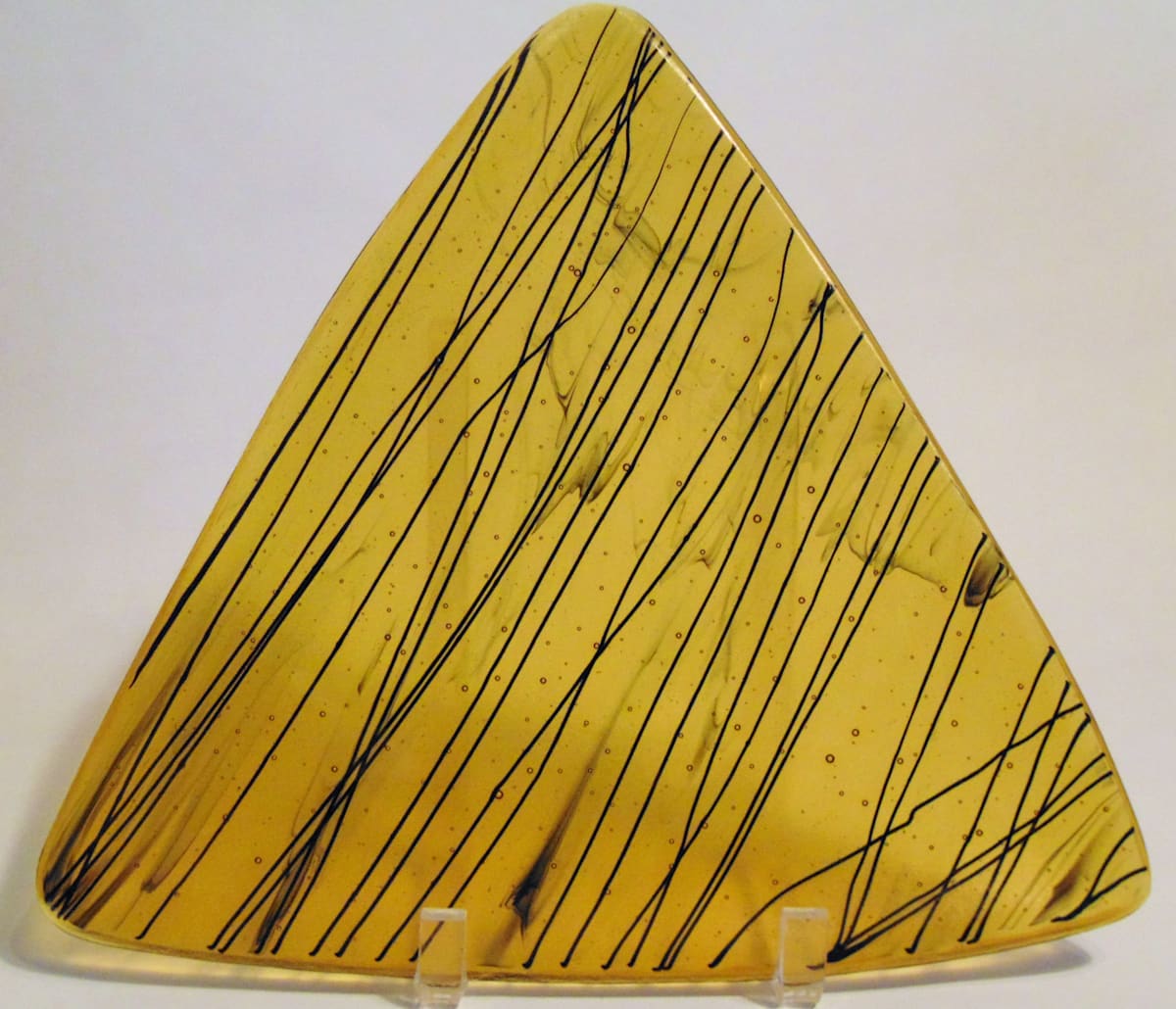 Triangular Plate-Amber with black stringer by Kathy Kollenburn, Image 1.