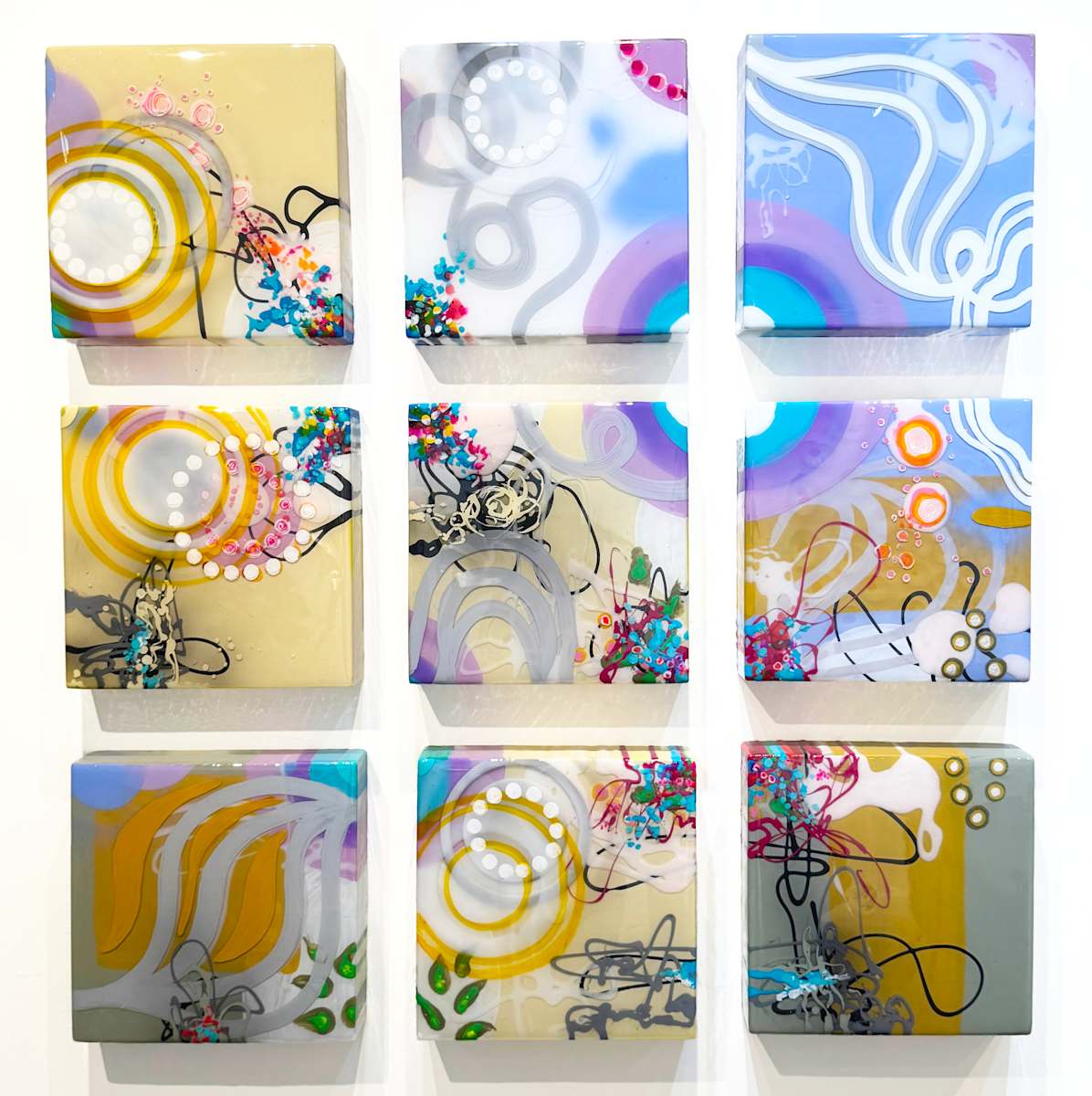 The Air Between Laughter and Light by Jennifer Haley  Image: A luminous mixed-media work exploring the quiet threshold between joy and stillness. Layers of resin and pigment capture the sensation of coming home to oneself — where laughter softens into light and peace fills the space in between.